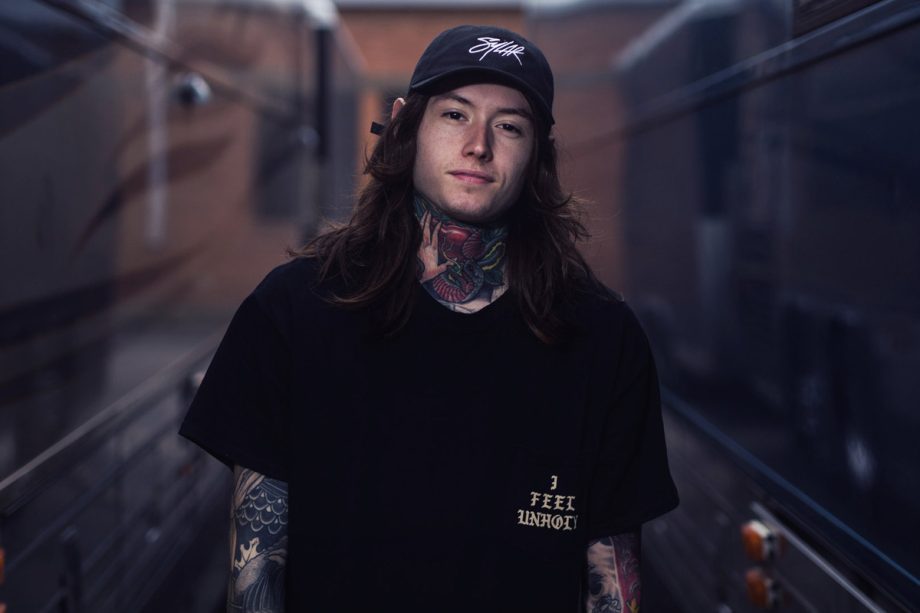 noah sebastian of bad omens photoshoot by bryan kirks wearing black tshirt and cap 920x613 1 - Ateez Store